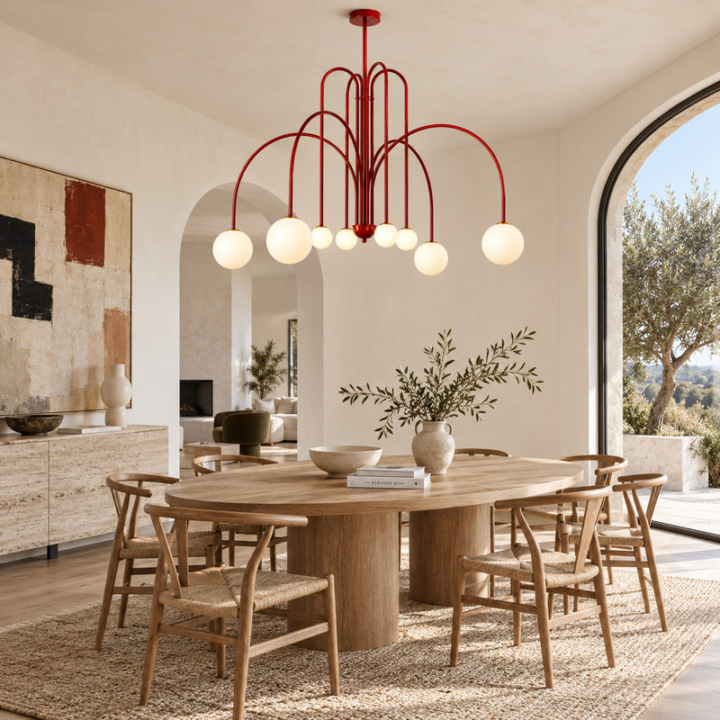 Gran Finale glass chandelier casting warm light over an elegant dining room table