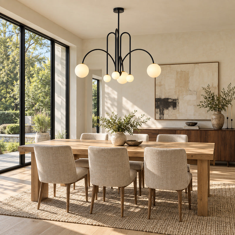 Gran Finale glass chandelier casting warm light over an elegant dining room table
