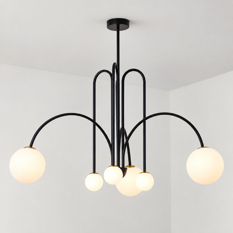 Six-head black Gran Finale glass chandelier over a dining table as a clustered statement