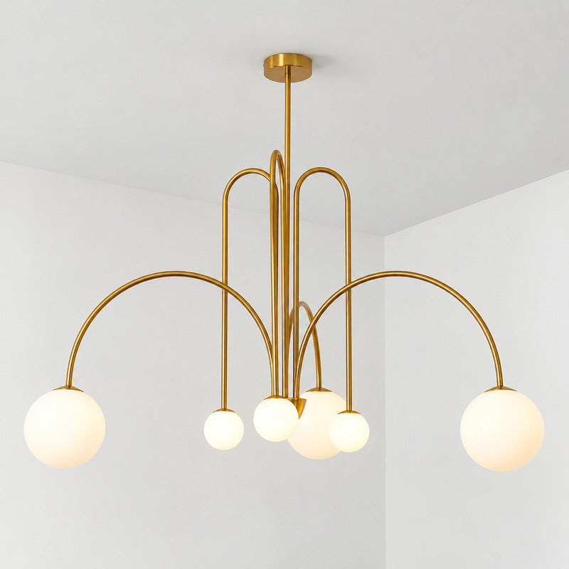 Six-head copper Gran Finale glass chandelier casting a warm glow over a dining table
