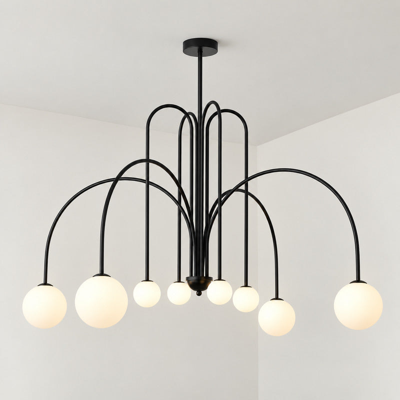 Six-head copper Gran Finale glass chandelier casting a warm glow over a dining table