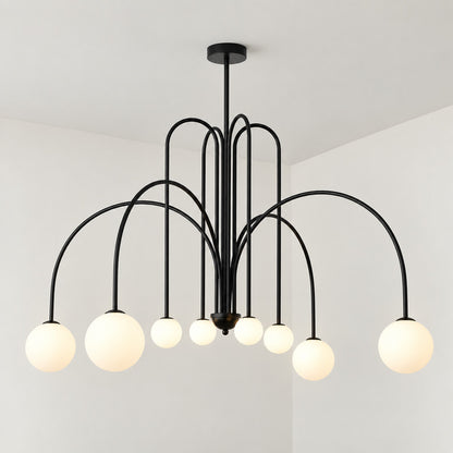 Six-head copper Gran Finale glass chandelier casting a warm glow over a dining table