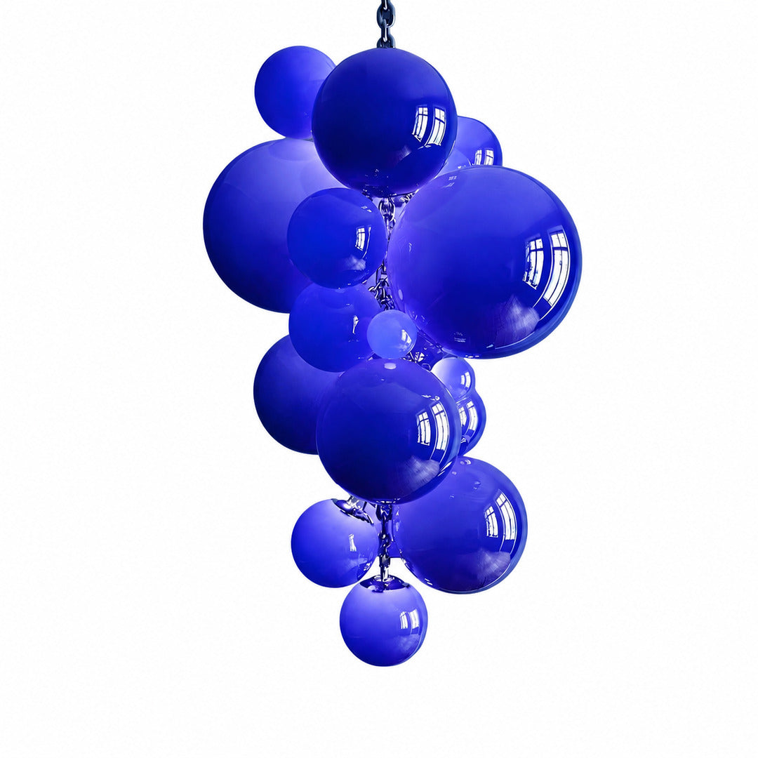 Grappolo glass chandelier with a hand-blown cluster of glowing glass globes suspended over a dining table