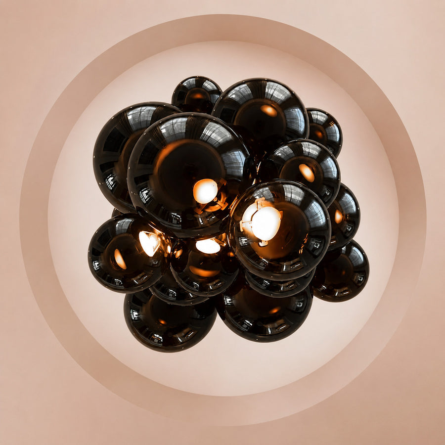 Tall Grappolo glass chandelier cascading in a grand double-height entryway foyer
