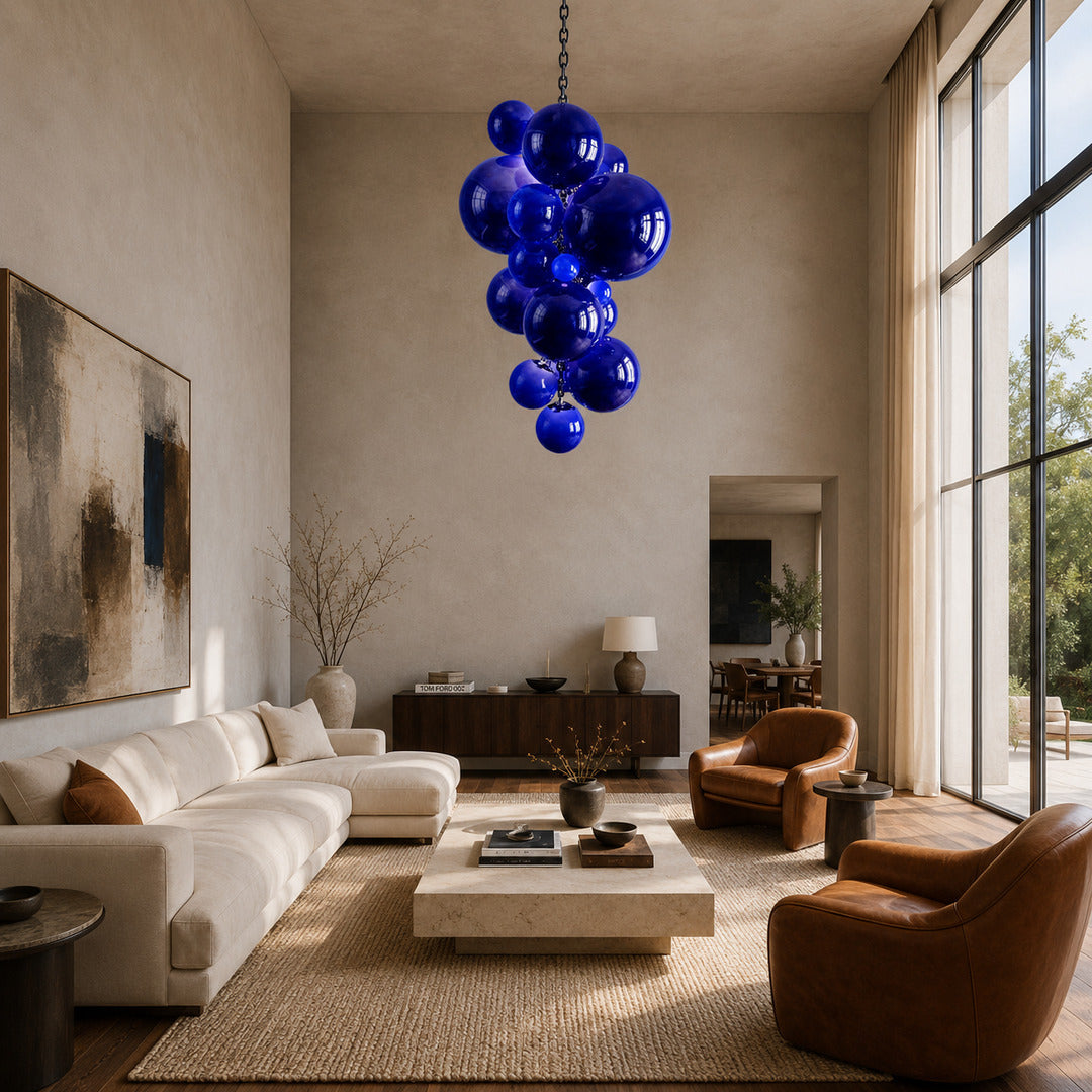 Grand Grappolo glass chandelier anchoring a double-height great room with tall windows