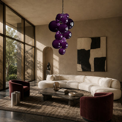 Grappolo glass chandelier as a colorful sculptural centerpiece in a modern living room