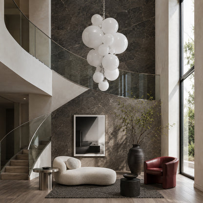 Grappolo glass chandelier as a colorful sculptural centerpiece in a modern living room
