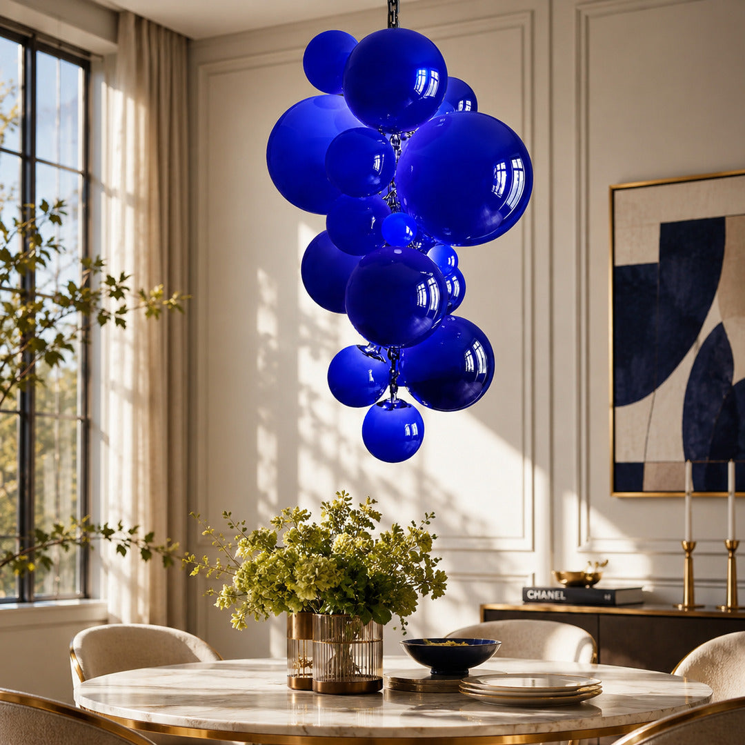 Grappolo glass chandelier casting a warm glow over an elegant dining room table