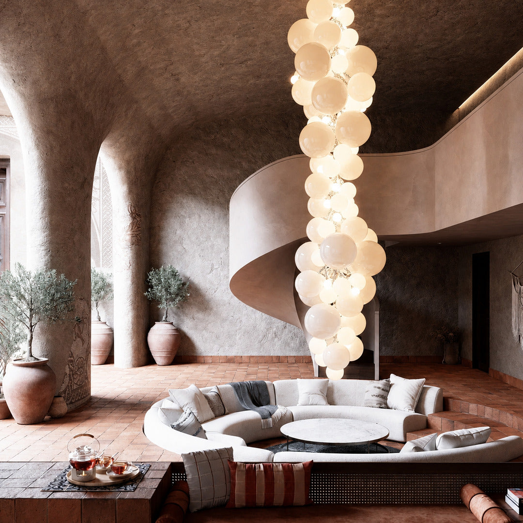 Grand Grappolo glass chandelier anchoring a double-height great room with tall windows