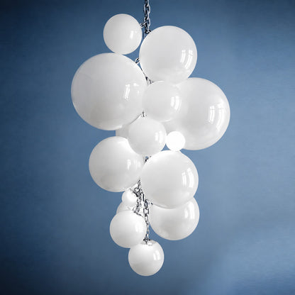 Small 39.4-inch white Grappolo glass chandelier over a dining table