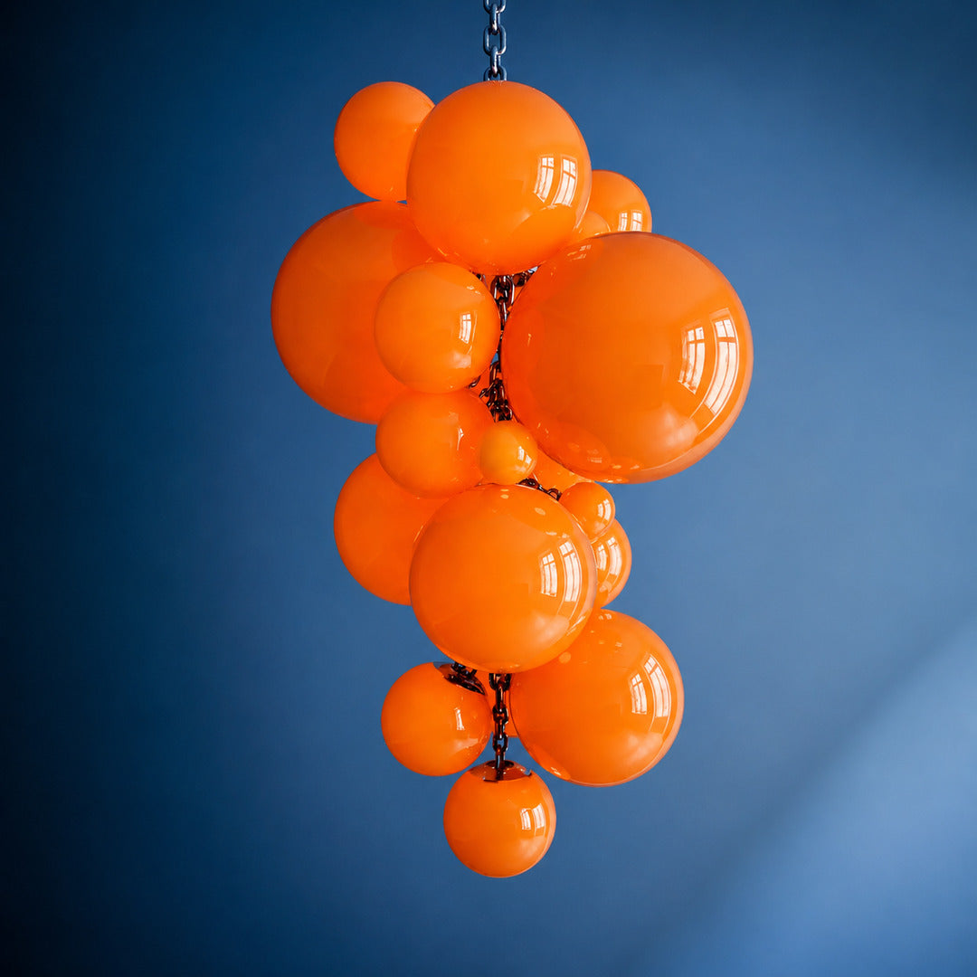 Small 39.4-inch orange Grappolo glass chandelier as a warm colorful accent over a table