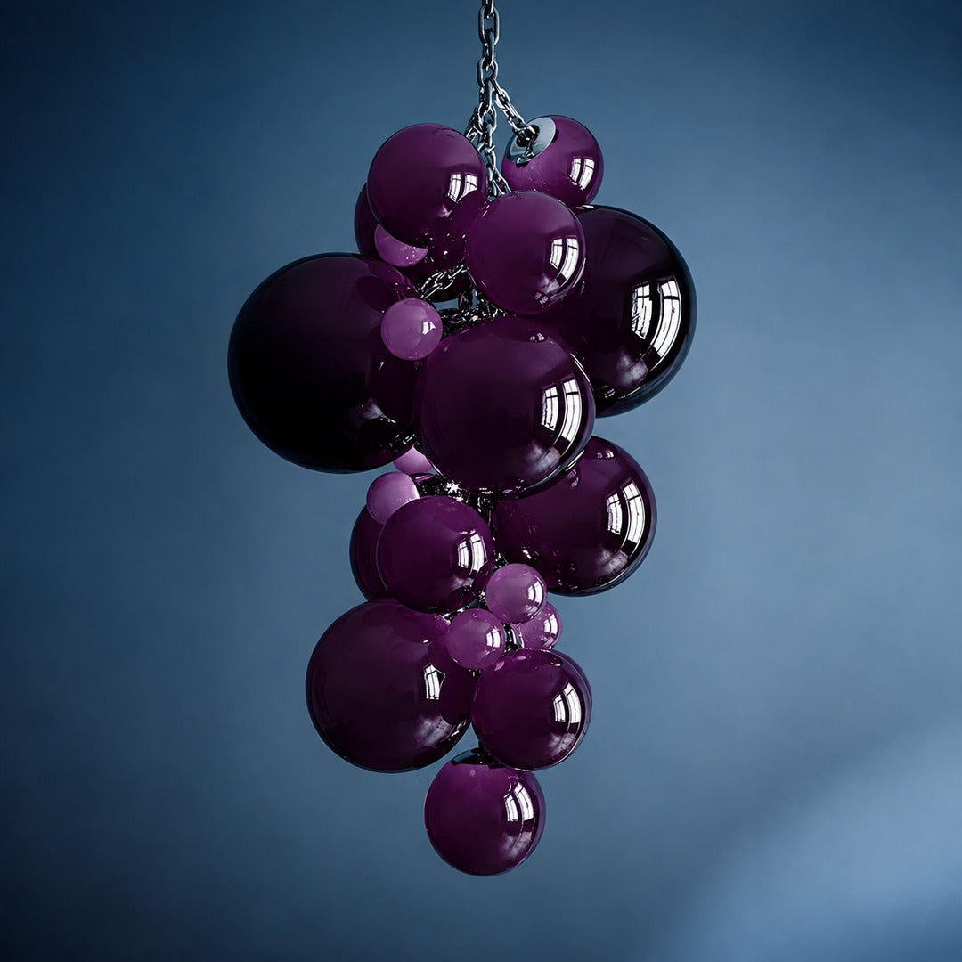 Small 39.4-inch purple Grappolo glass chandelier adding a rich jewel tone to a dining room