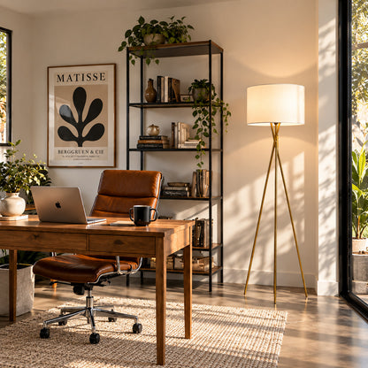 Grazia gold tripod floor lamp adding a refined accent to a home office corner
