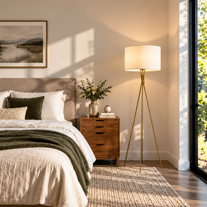 Grazia floor lamp adding a warm minimalist accent beside a modern master bedroom bed