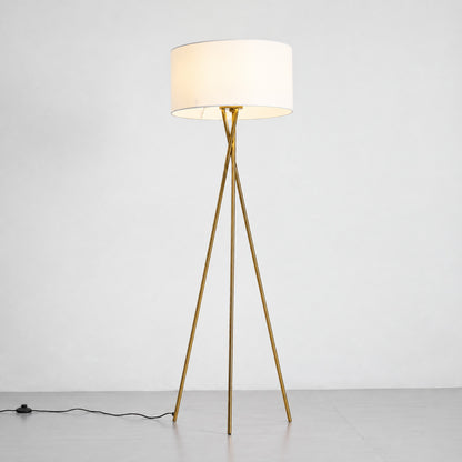 Warm even glow diffusing through the white fabric shade of the Grazia floor lamp