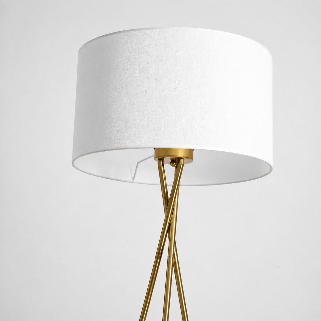 Detail of the soft fabric drum shade in white or linen diffusing a warm glow on the Grazia floor lamp