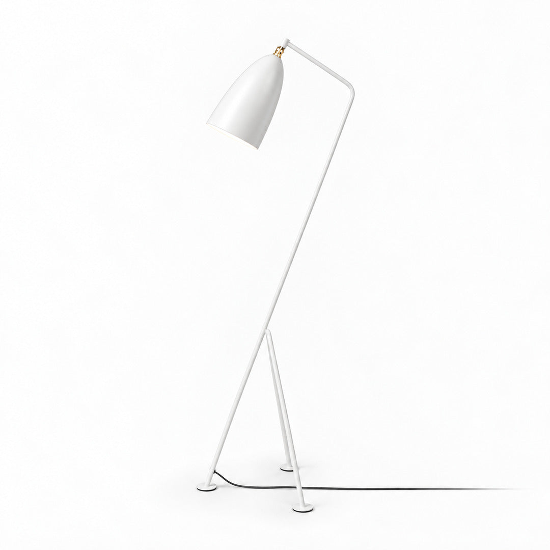 White Grillo angled metal floor lamp as a sleek accent in a bright modern room