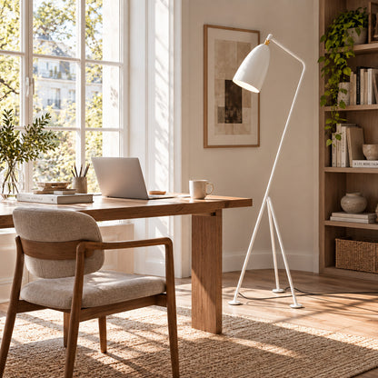 Grillo floor lamp angled over a home office desk for focused task lighting