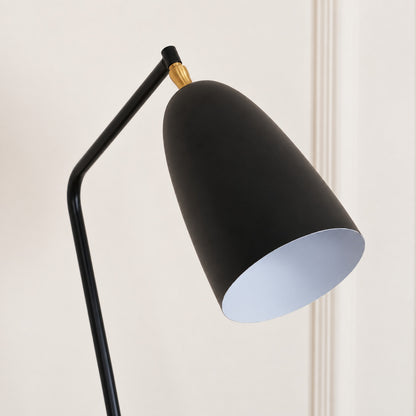 Detail of the adjustable conical shade on the Grillo floor lamp directing light for tasks