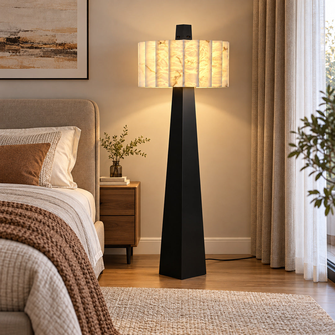 Guglia alabaster floor lamp casting a warm glow in a primary bedroom