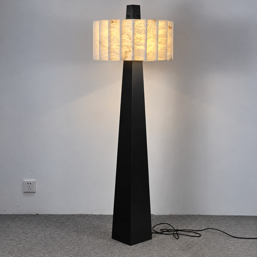 Close-up of natural veining glowing through the alabaster shade of the Guglia floor lamp