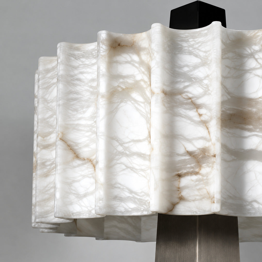 Close-up of the milky white natural alabaster shade of the Guglia floor lamp unlit