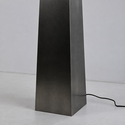 Detail of the tapered matte black obelisk base of the Guglia alabaster floor lamp