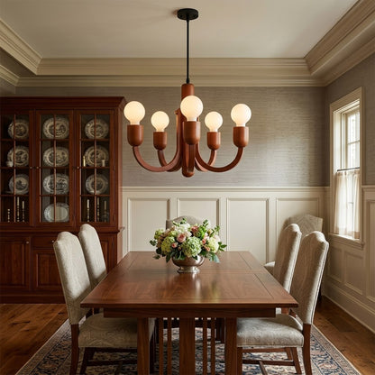 Hadley Model A walnut wood chandelier above Mid Century dining table Eames era furnishings retro modernist interior warm glow