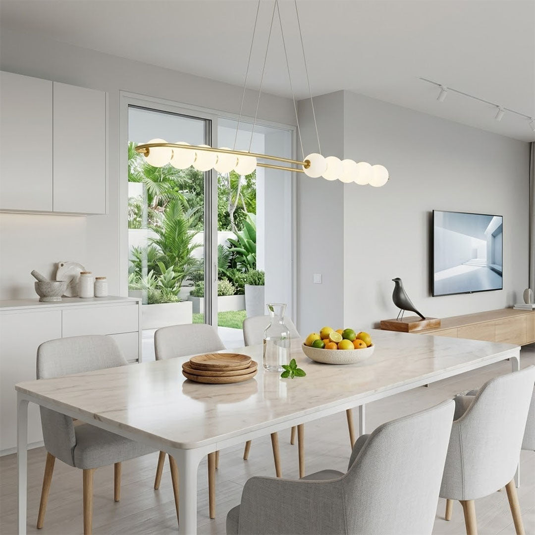 Halia pearl ring chandelier above round dining table elegant warm glow modern interior