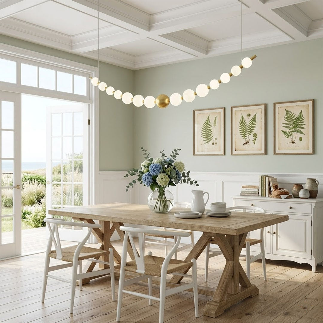 Halia pearl ring chandelier above round dining table elegant warm glow modern interior
