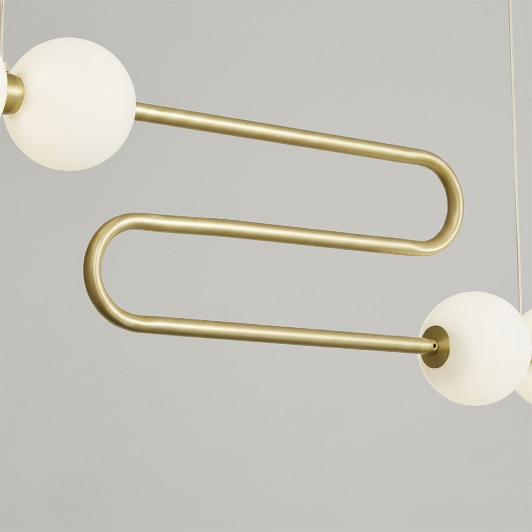 Halia chandelier brass ring frame pearl finished acrylic globes detail close up