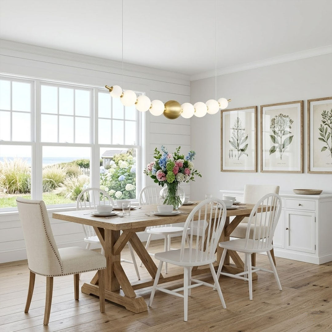 Halia pearl ring chandelier above round dining table elegant warm glow modern interior