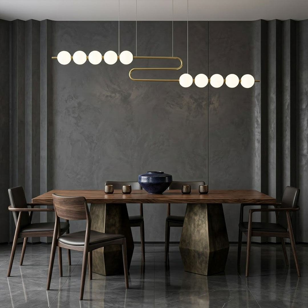 Halia pearl ring chandelier above round dining table elegant warm glow modern interior
