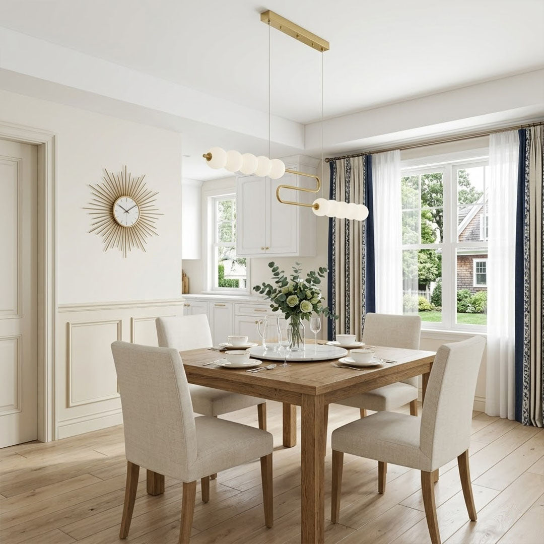 Halia pearl ring chandelier above round dining table elegant warm glow modern interior