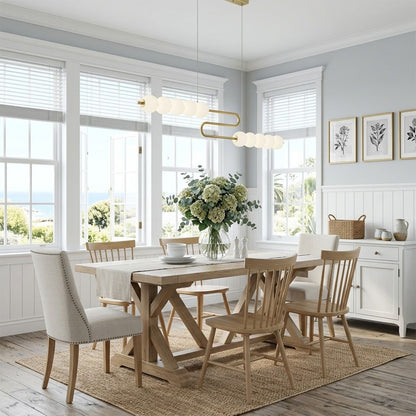 Halia pearl ring chandelier above round dining table elegant warm glow modern interior