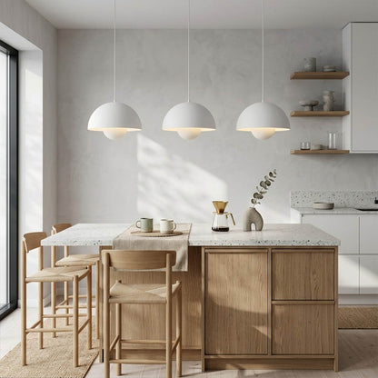 Halo pendant lights three in a row above kitchen island mid century modern interior