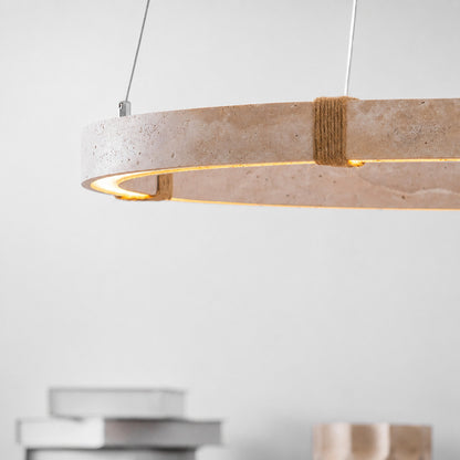 Halo travertine pendant light illuminated warm light glowing through stone veining amber honey detail close up