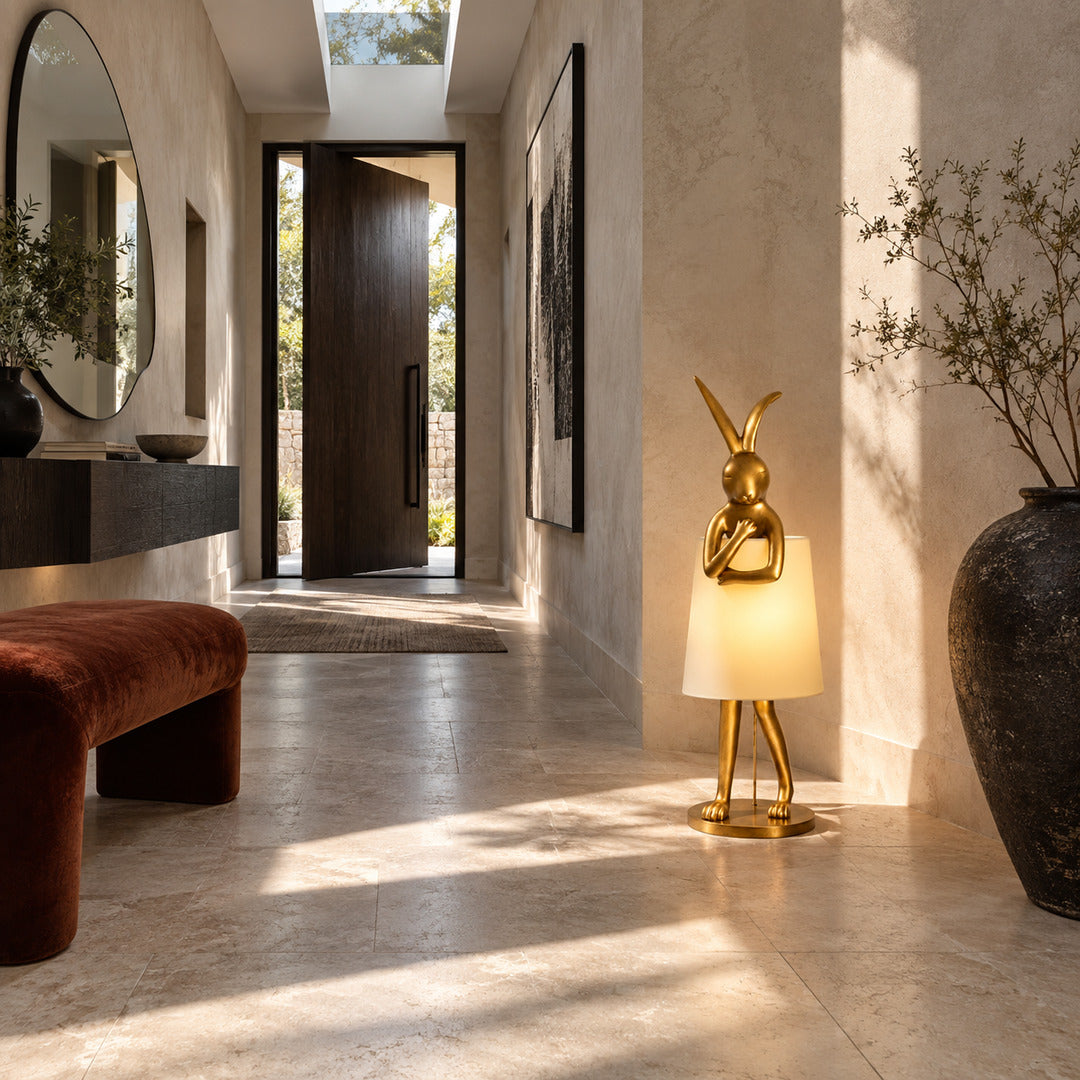 Hare silhouette table lamp welcoming guests with a golden sculpture on an entryway console