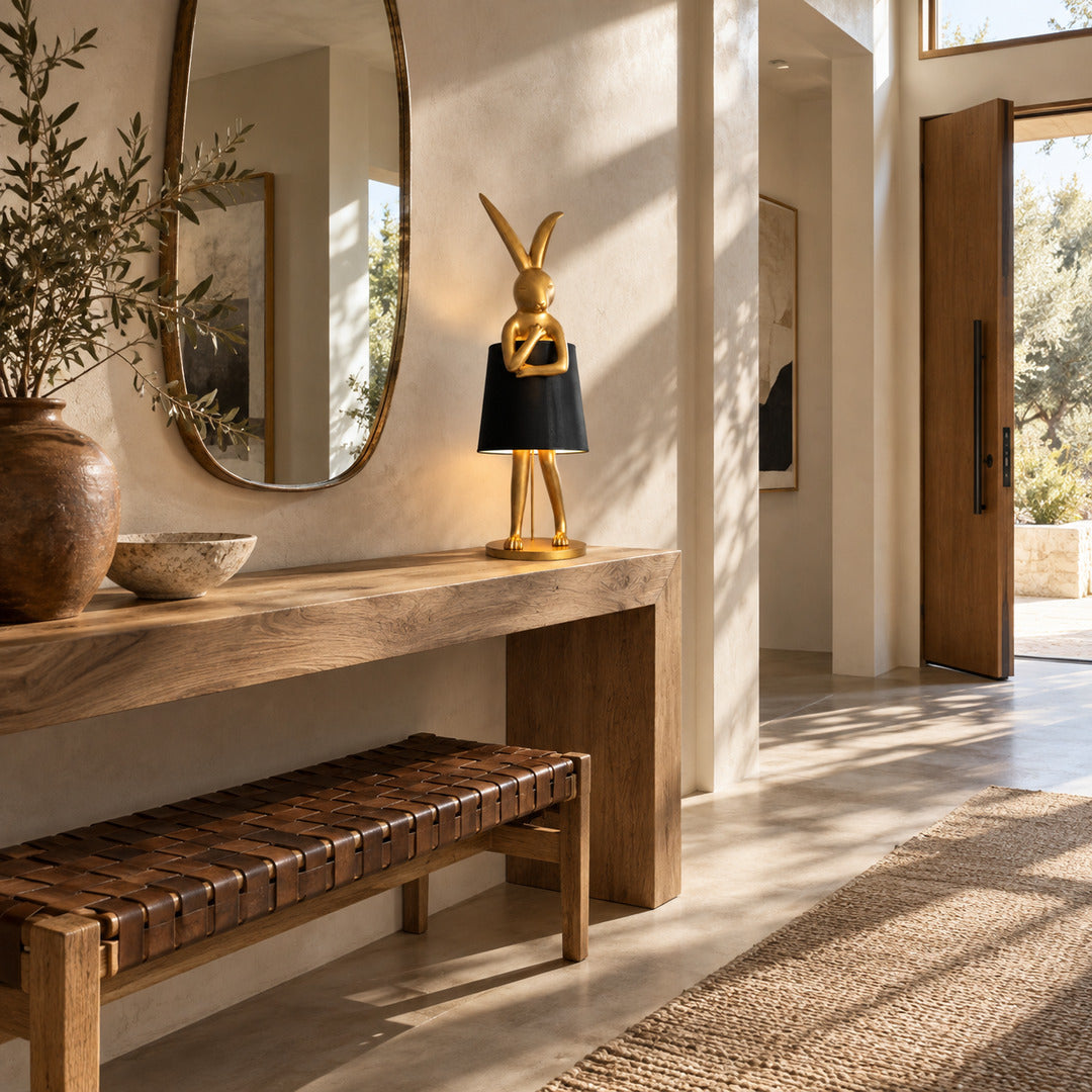 Hare silhouette table lamp accenting a bookshelf with its golden hare silhouette