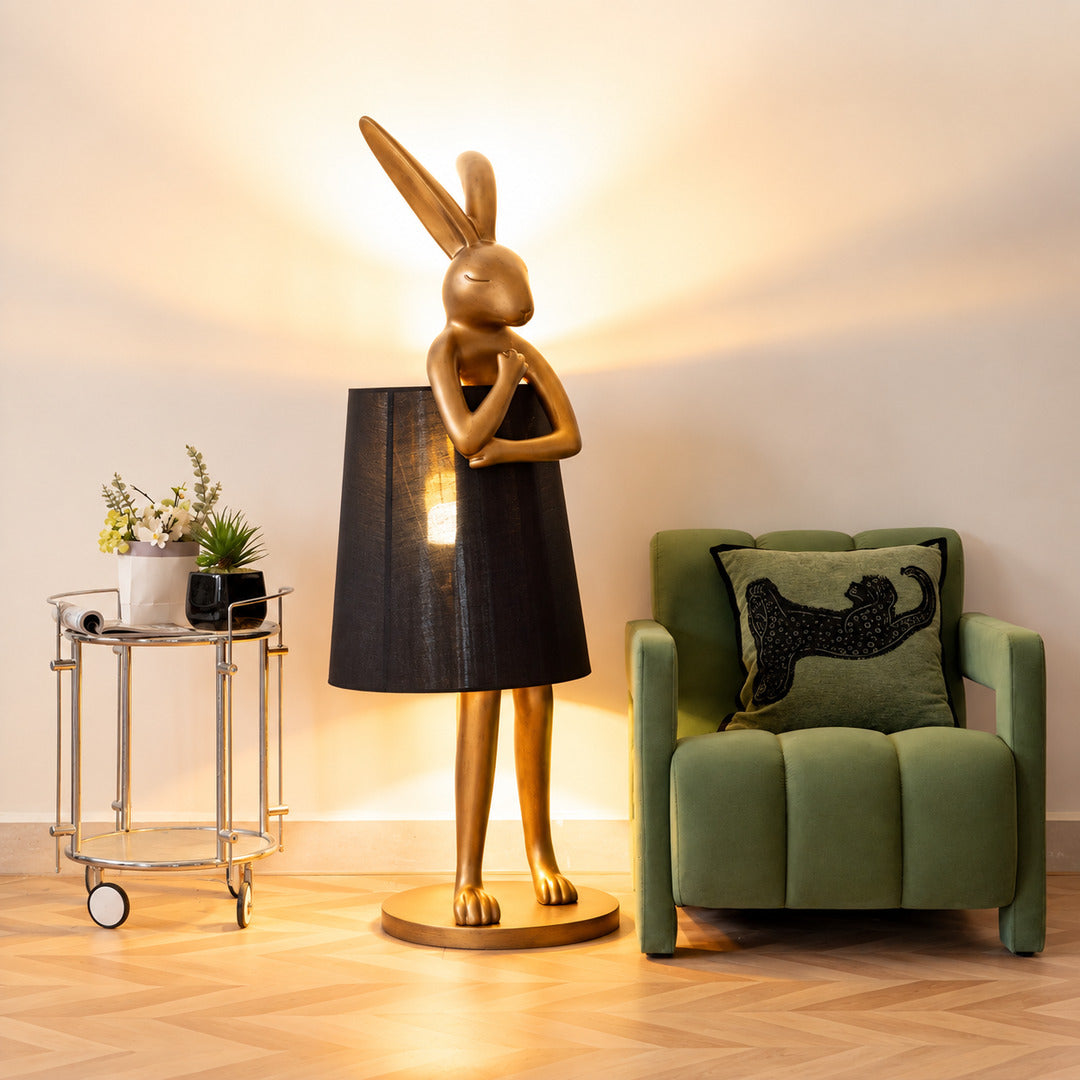 Hare silhouette table lamp casting a warm glow in a cozy corner reading nook