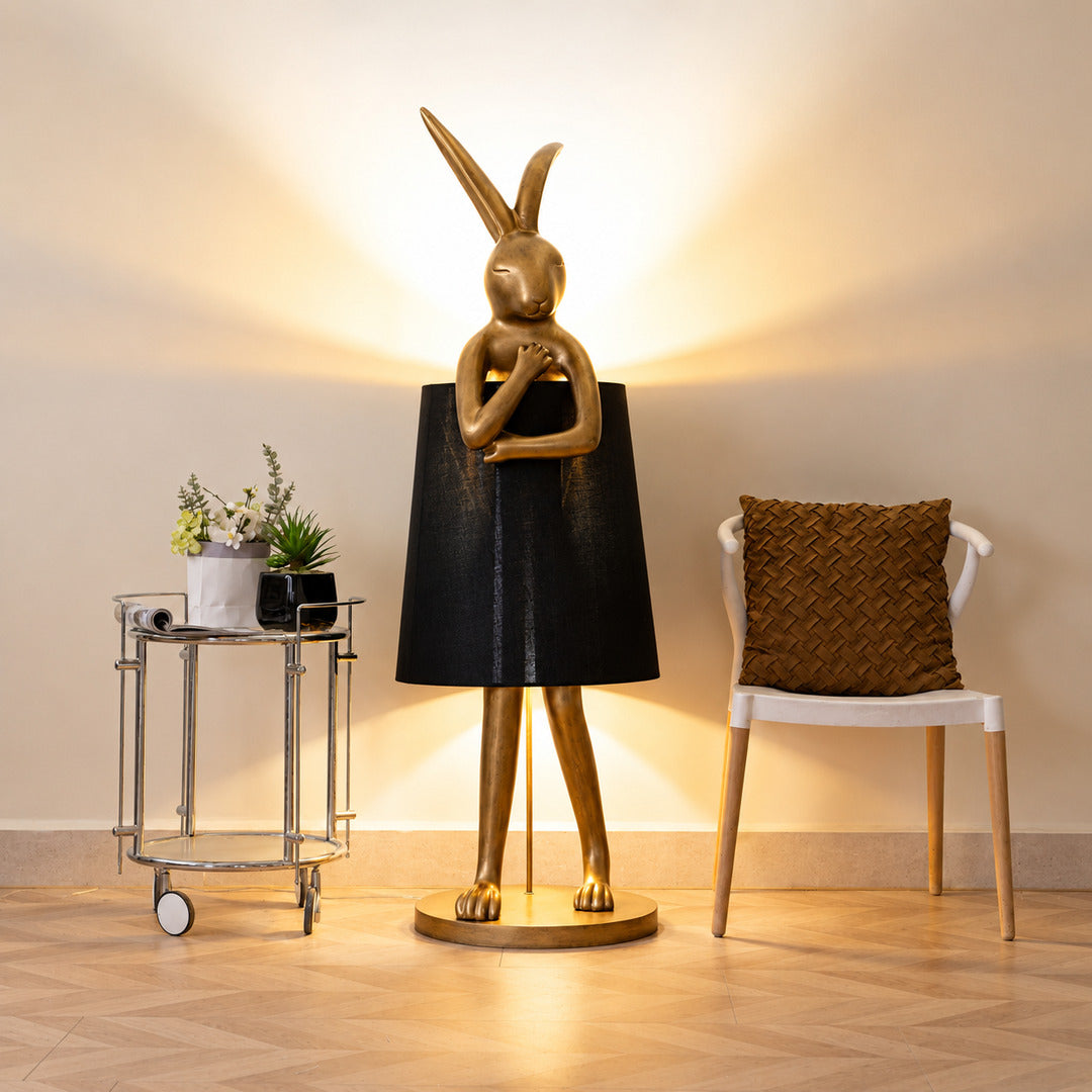 Hare silhouette table lamp casting a warm glow in a cozy corner reading nook
