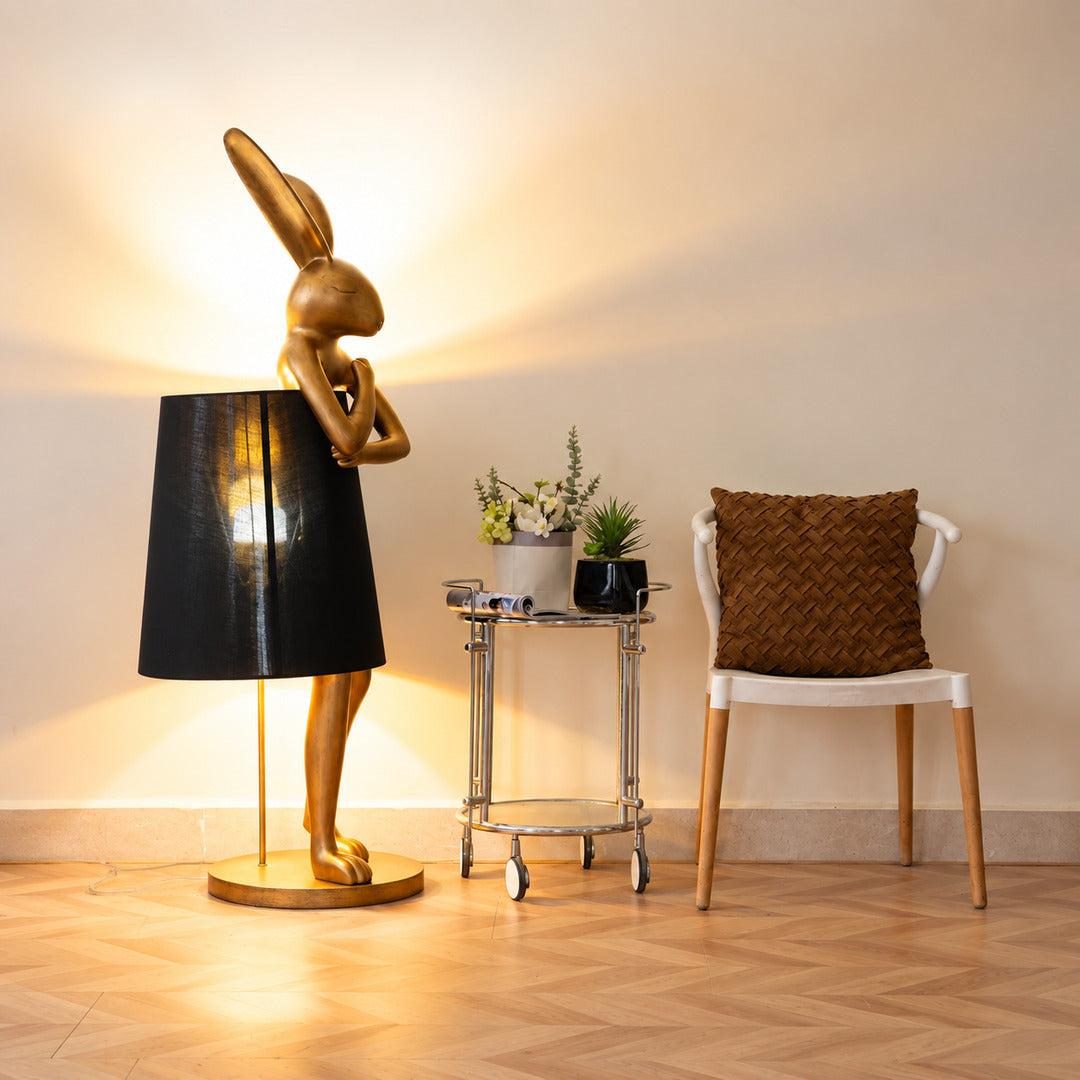 Hare silhouette table lamp casting a warm glow in a cozy corner reading nook