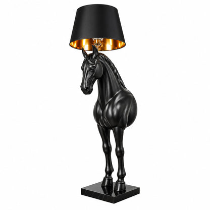 Horse head floor lamp with a sculptural resin horse head holding a fabric shade glowing warm in a living room
