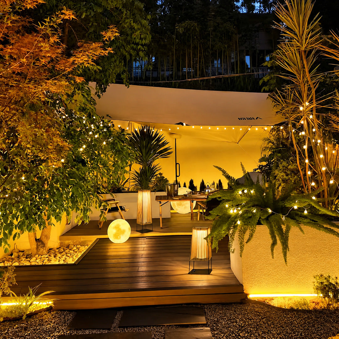Intreccio outdoor post light adding a cozy woven glow to a small balcony corner