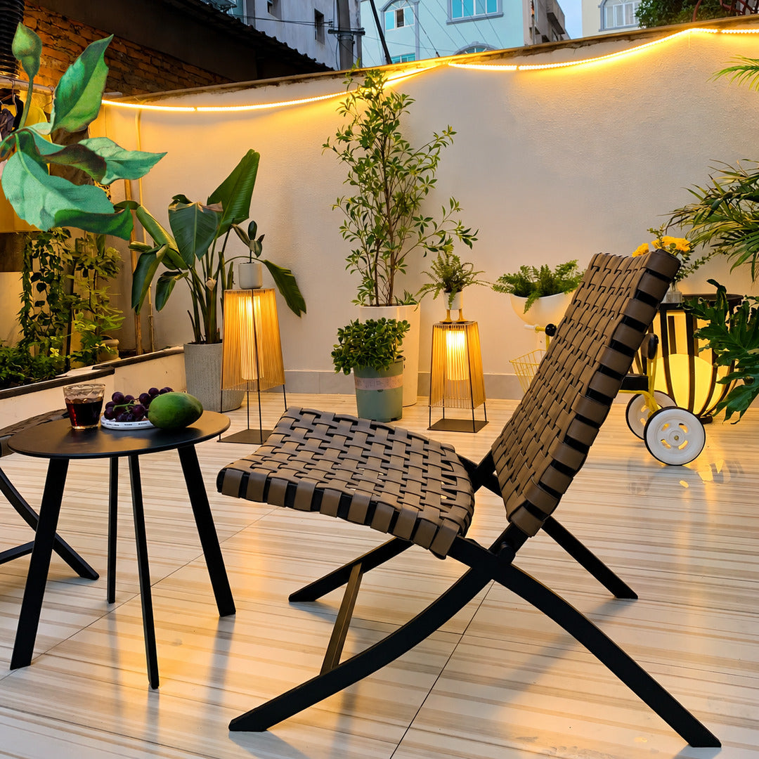 Tall Intreccio outdoor post light standing as a floor lantern on a backyard deck