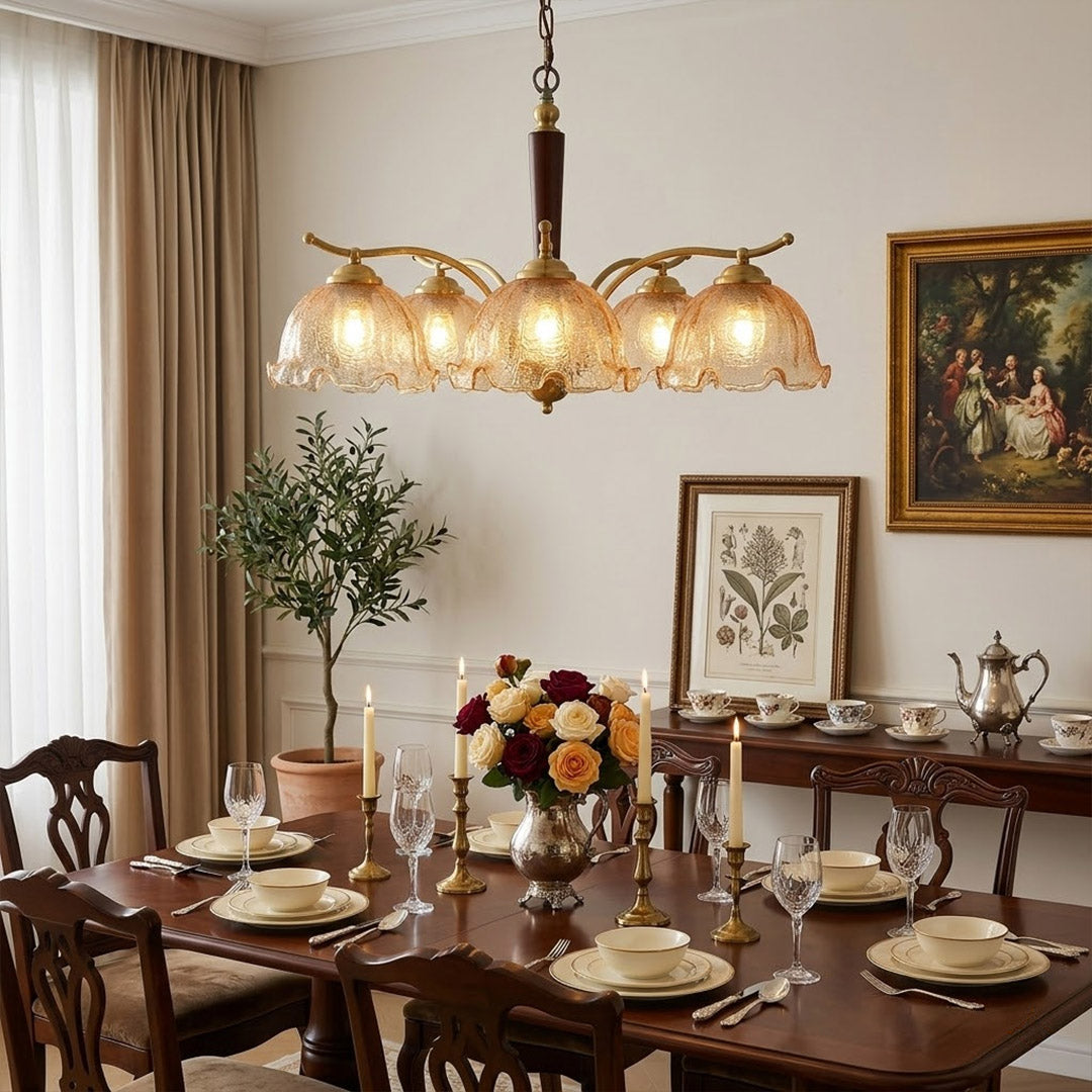 Iris 24 inch rippled glass wood chandelier above modern dining room rectangular table warm Edison glow transitional interior