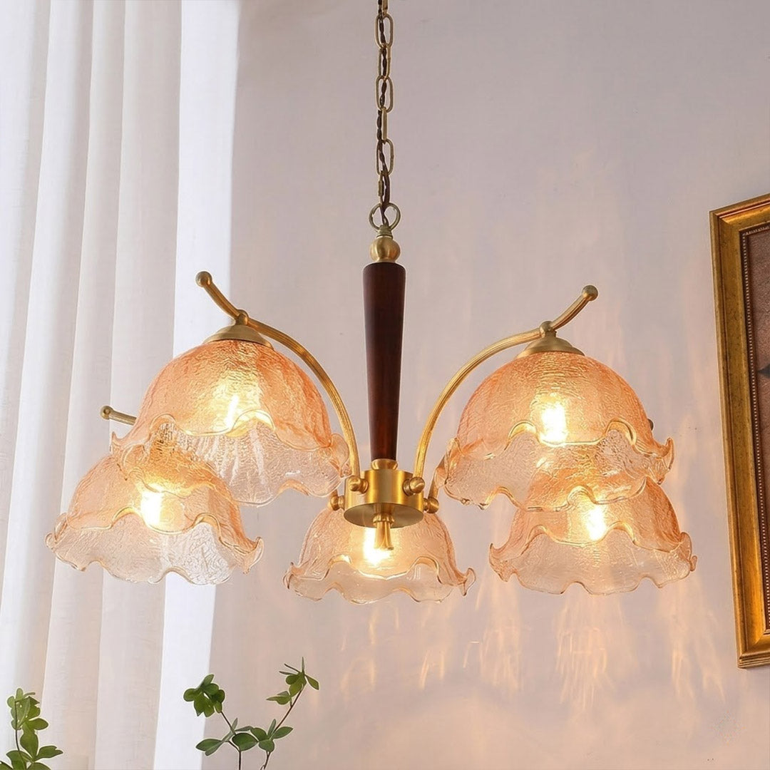Iris rippled glass shade close up illuminated warm amber glow Edison filament bulb visible refraction texture detail