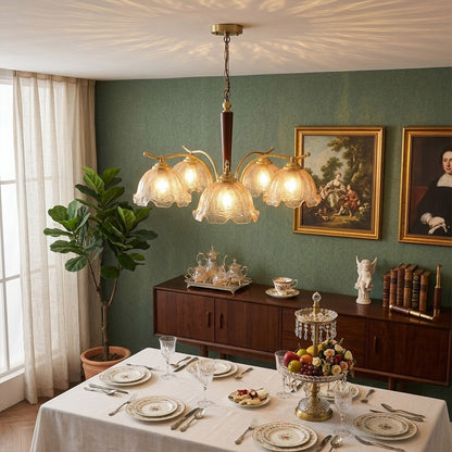 Iris 24 inch rippled glass wood chandelier above modern dining room rectangular table warm Edison glow transitional interior