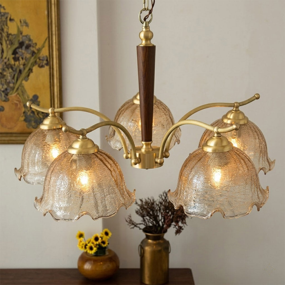 Iris chandelier wood accent at metal arm joint close up natural warmth detail craftsmanship transitional design
