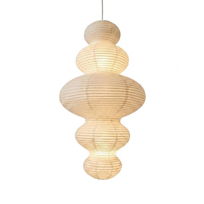 Stuber Lighting Japandi style rice paper pendant lamp with a multi-tiered ribbed lantern silhouette, perfect for Wabi-Sabi and minimalist organic modern interior designs.
